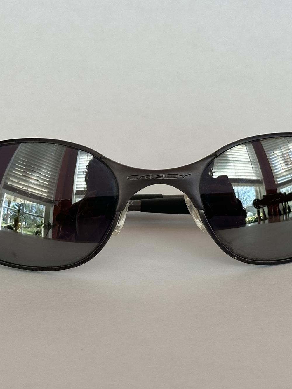 Oakley Black Frame Sunglasses with Dark Mirrored Lenses
